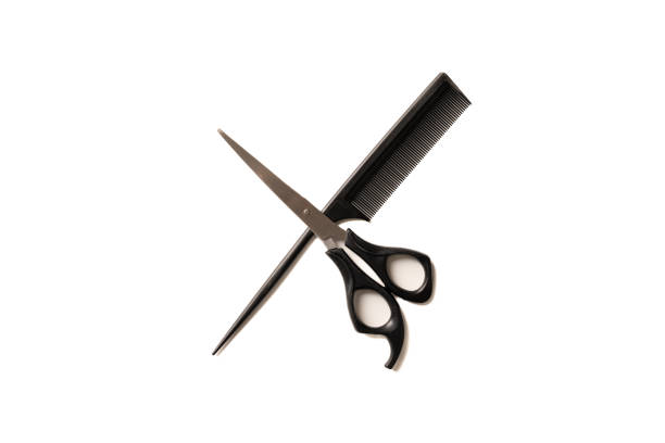 istock Comb and scissors isolated on the white background 1364238382
