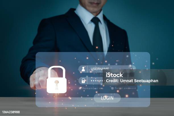 Exploiting A Phishing For Access Via A Password Internet Security Difficulties And Fraud Are All Manifestations Of The Concept A Businessman Who Possesses A Safe Deposit Box Stock Photo - Download Image Now
