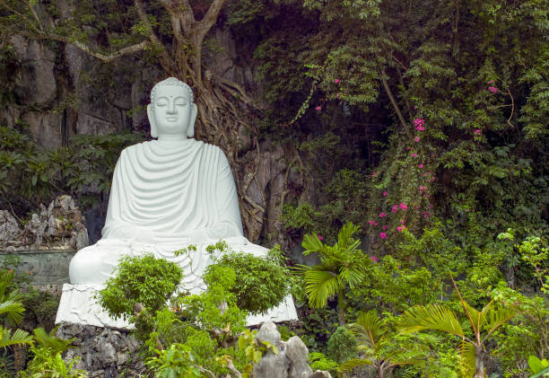 Asia,Vietnam, Danang,a statue of Buddha in the garden of the temple on the Marble mountain