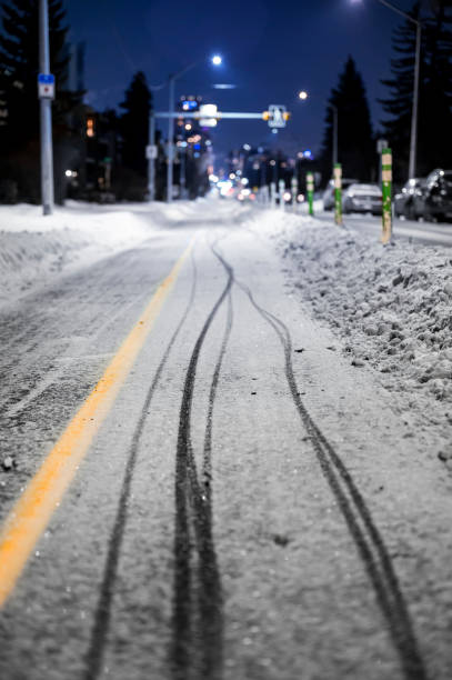 istock Bicycle tracks in snow on bike path in winter 1364242792