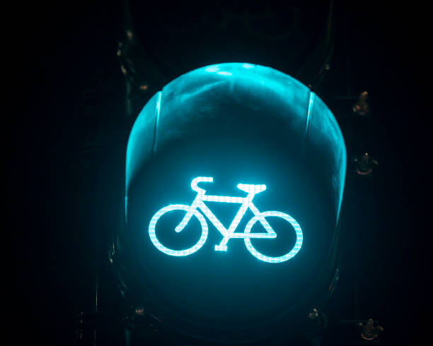 istock Green bicycle traffic stop light closeup 1364242926