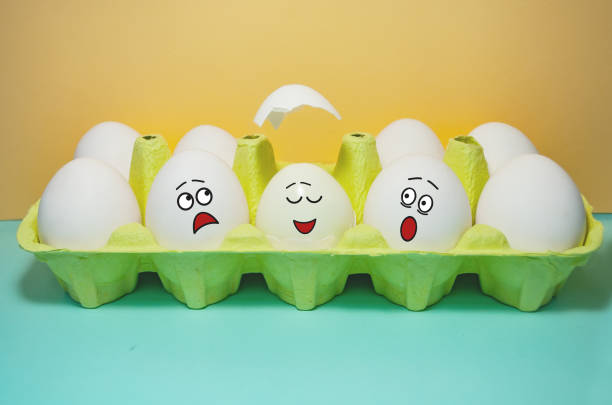 istock Funny eggs with faces with different facial expressions in a box. Holy egg. Easter. Pastel colors 1364244564