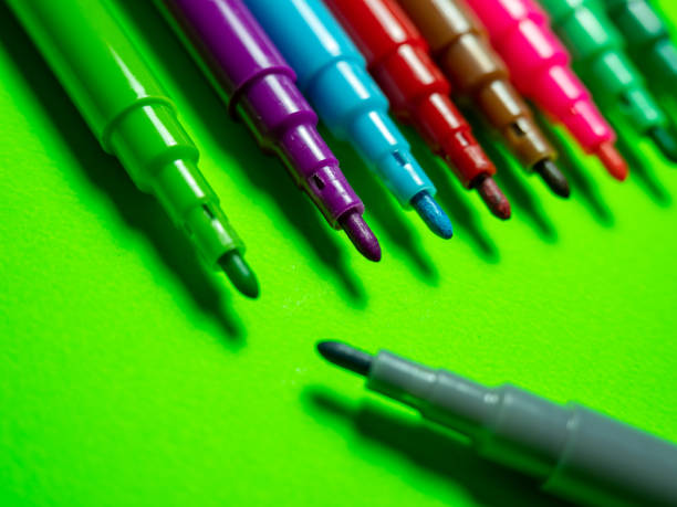 istock Colored markers on a green background 1364244919