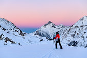 Skier in ski-resort Lech after sunset