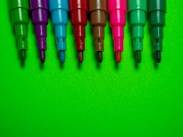 istock Colored markers on a green background 1364246238