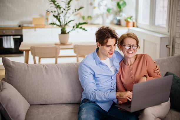 istock Joyful different generations family enjoying web surfing 1364248188