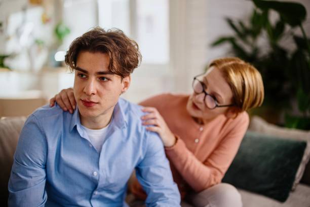 istock Mother gave her son a consoling pat on the back 1364248227