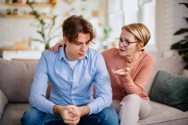 istock Mother gave her son a consoling pat on the back 1364248233