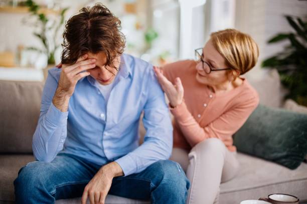 istock Mother gave her son a consoling pat on the back 1364248246