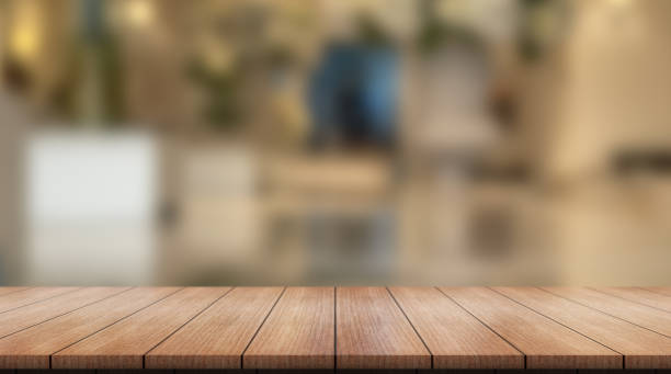 istock Empty wooden table top with lights bokeh on blur restaurant background. 1364249364