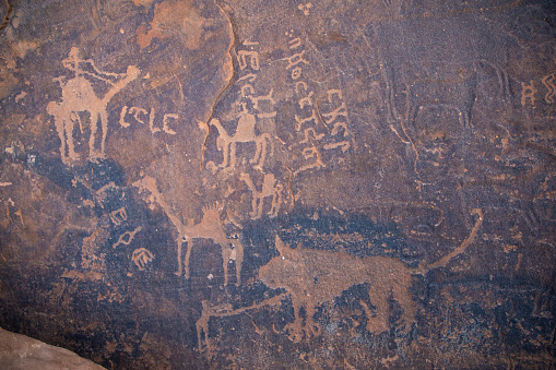 ancient petroclyphs on a cave wall in Saudi Arabia