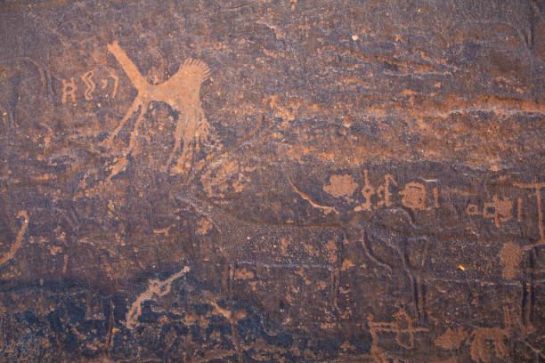 istock petroclyphs on a cave wall in Saudi Arabia 1364252369