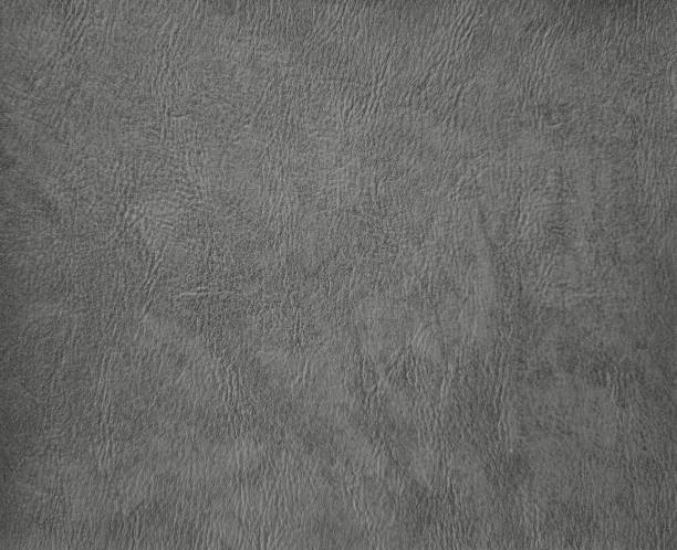 istock old light black faux leather. grey artificial leather background for luxury and elegant concept. plain background of light grey leather in close-up view. 1364253412