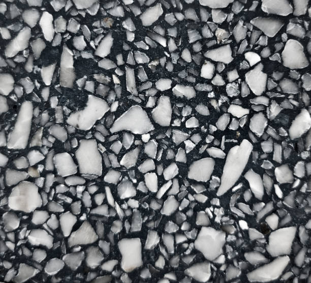 istock real black terrazzo stone texture background for interior vintage mood and tone. white and grey irregular stone fragments on black stone background. trendy and stylish composite stone texture. 1364253662