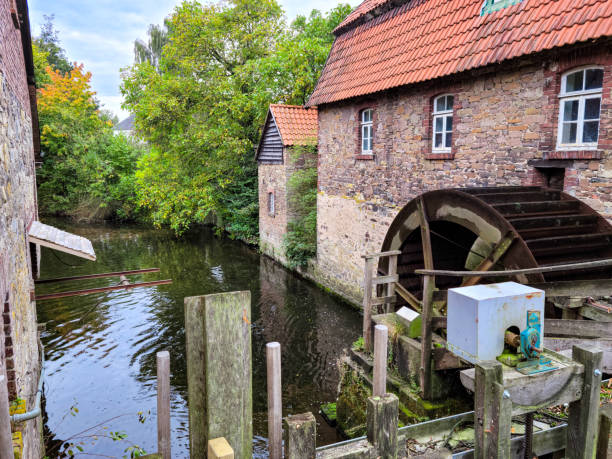 istock Old water mill on the river. Grinding mill 1364255554