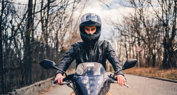 istock Man riding a motorbike 1364257550