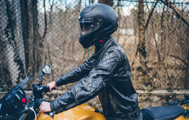 istock Man riding a motorbike 1364257621