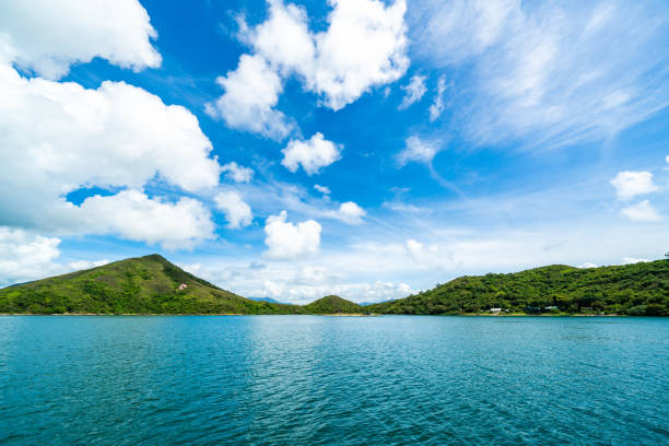 istock Green island under blue sky in sunny day 1364258021