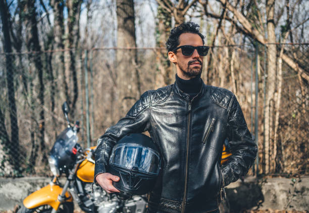 istock Man with motorbike 1364258041