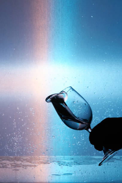 splash of water in a wine glass