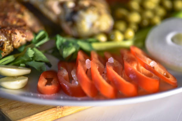 Tomato salad with feta cheese in a restaurant. Vegetarian dish.