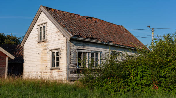 istock Old abandoned white wooden house. 1364266361