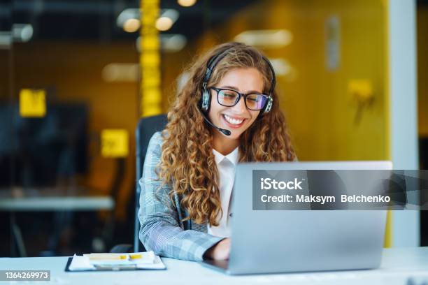 Call Center Agent With Headset Working On Support Hotline In Modern Office Stock Photo - Download Image Now