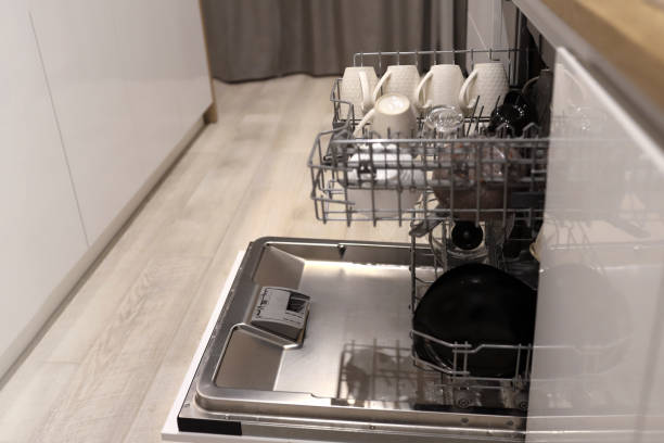 istock Open dishwasher with clean dishes after washing in modern scandinavian kitchen 1364271093
