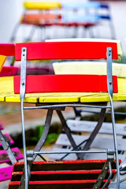 colorful folding chairs at a beergarden - photo