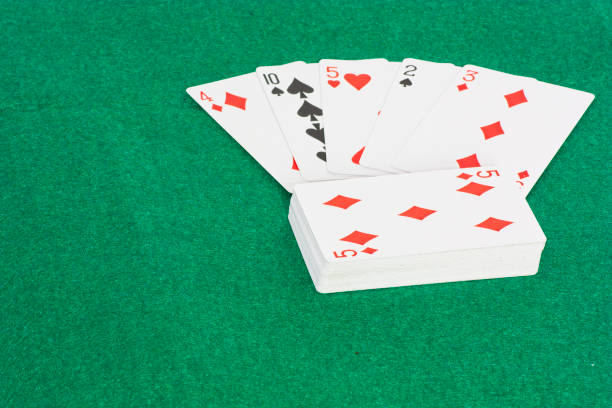 istock A deck of cards laid out on a green background 1364272132