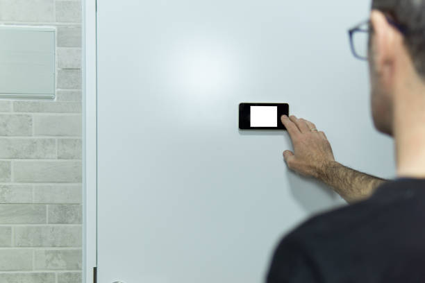 Man touching and watching with the digital peep hole, with white background