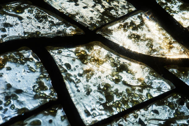 istock Colored glass mosaic close-up with sunlight passing through. Abstract background 1364275933