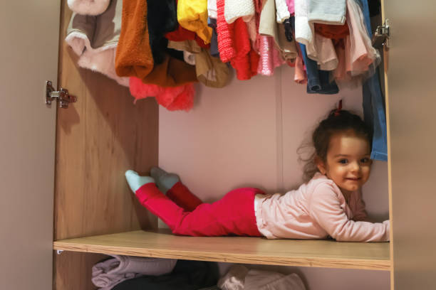 istock Little girl in the wardrobe 1364276076