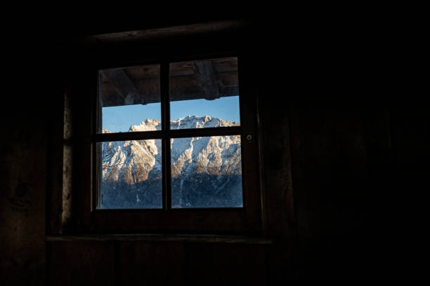 istock Snow-covered Alps viewed through window at Hoher Kranzberg 1364277223
