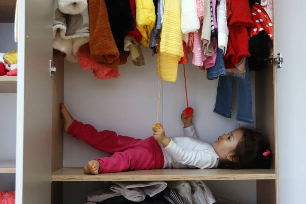istock Little girl in the wardrobe 1364277291