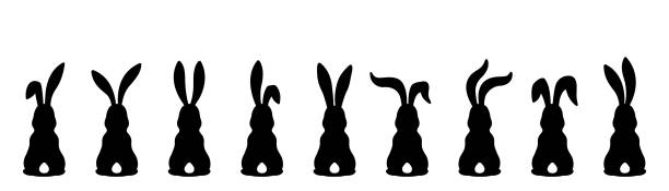 Silhouettes of Easter bunnies Nine different silhouettes of Easter bunnies isolated on a white background. easter silhouettes stock illustrations