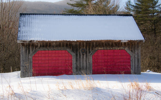 istock Old barn in a winter countryside landscape 1364282857