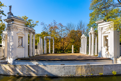 Warsaw, Poland - September 10, 2021: Historic Amphitheater in Royal Lazienki Krolewskie park near Palace on the Isle Palac na Wodzie in Ujazdow district of Warsaw