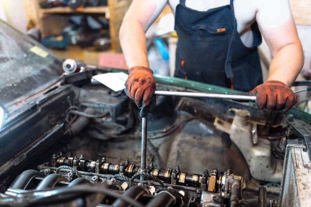 istock car engine repair, camshaft valve adjustment. 1364289915