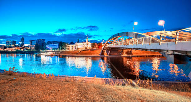 istock Illuminated bridge of Vilnius along Neris river, Lithuania. 1364291225