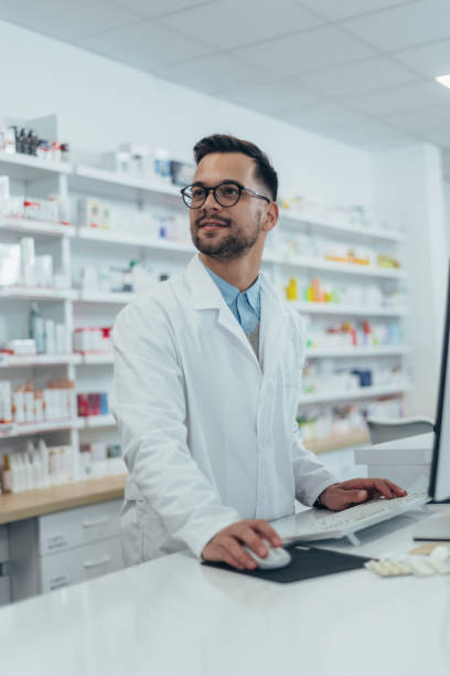 istock Portrait of a handsome pharmacist working in a pharmacy 1364296986