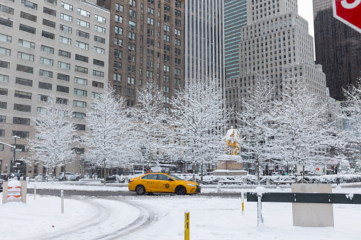 Classic New York City architecture overlooks Bryant Park after a fresh snowfall.