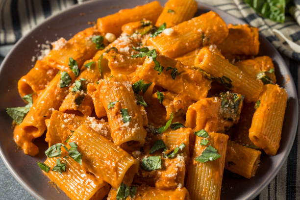 Healthy Homemade Vodka Rigatoni Pasta Healthy Homemade Vodka Rigatoni Pasta with Cheese and Basil penne stock pictures, royalty-free photos & images