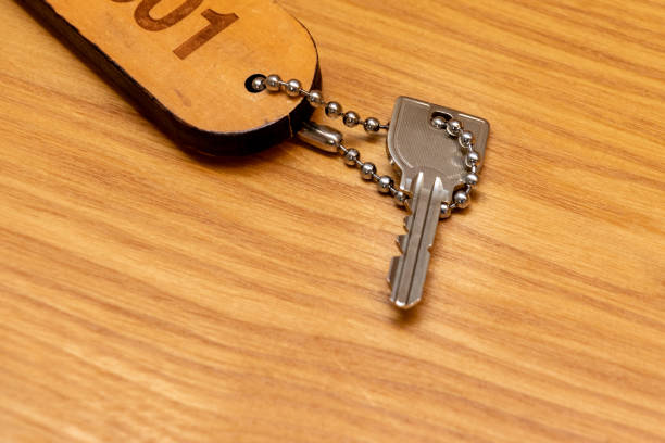 istock Room key on the wooden desk 1364309302