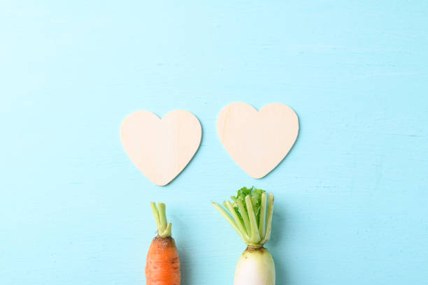 Organic carrot and white radish with heart shape, love concept, Valentine day