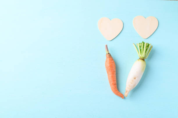 Organic carrot and white radish with heart shape, love concept, Valentine day