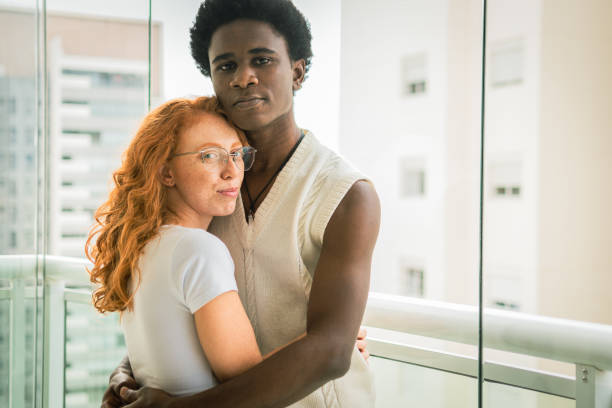 istock A couple embraces contrasting their skin tones 1364314580