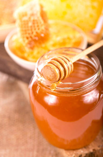 istock glass pot with floral honey isolated on white background 1364314873