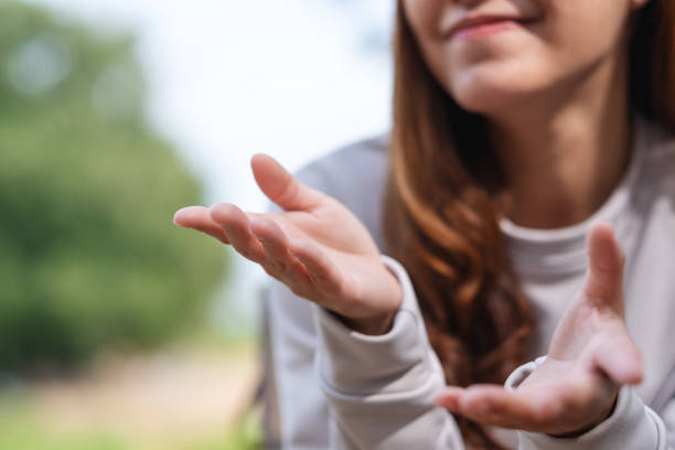 istock Closeup image of a young woman talking with body language 1364316525