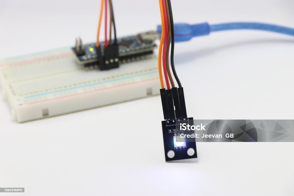 ARGB LED module connected to breadboard using jumper wires, Various electronic parts combined to make amazing science projects Blue Stock Photo